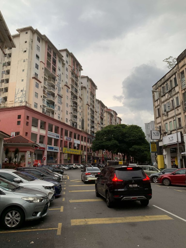 The commercial area to walk through after leaving the station